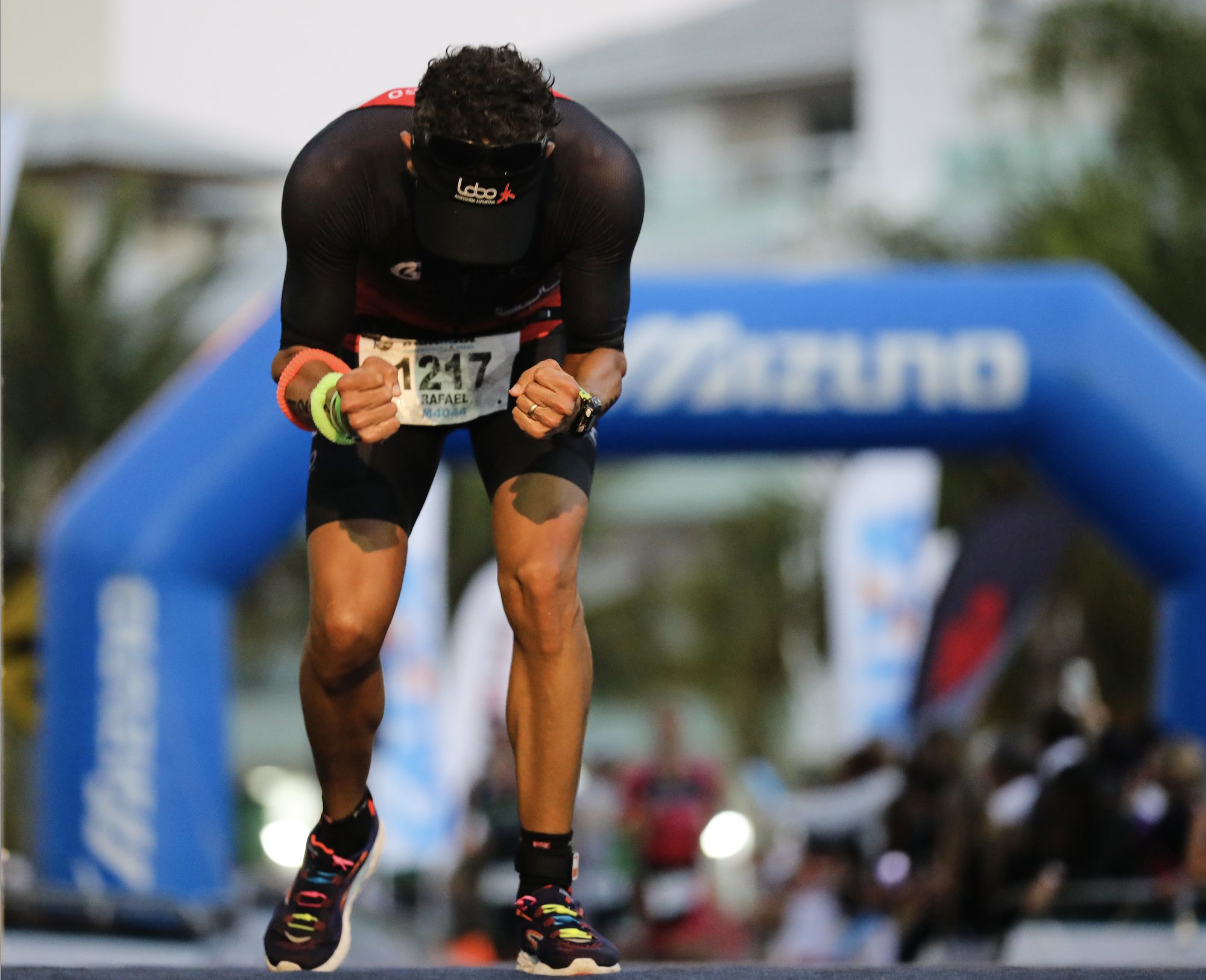 An endurance athlete at the finish of a triathlon